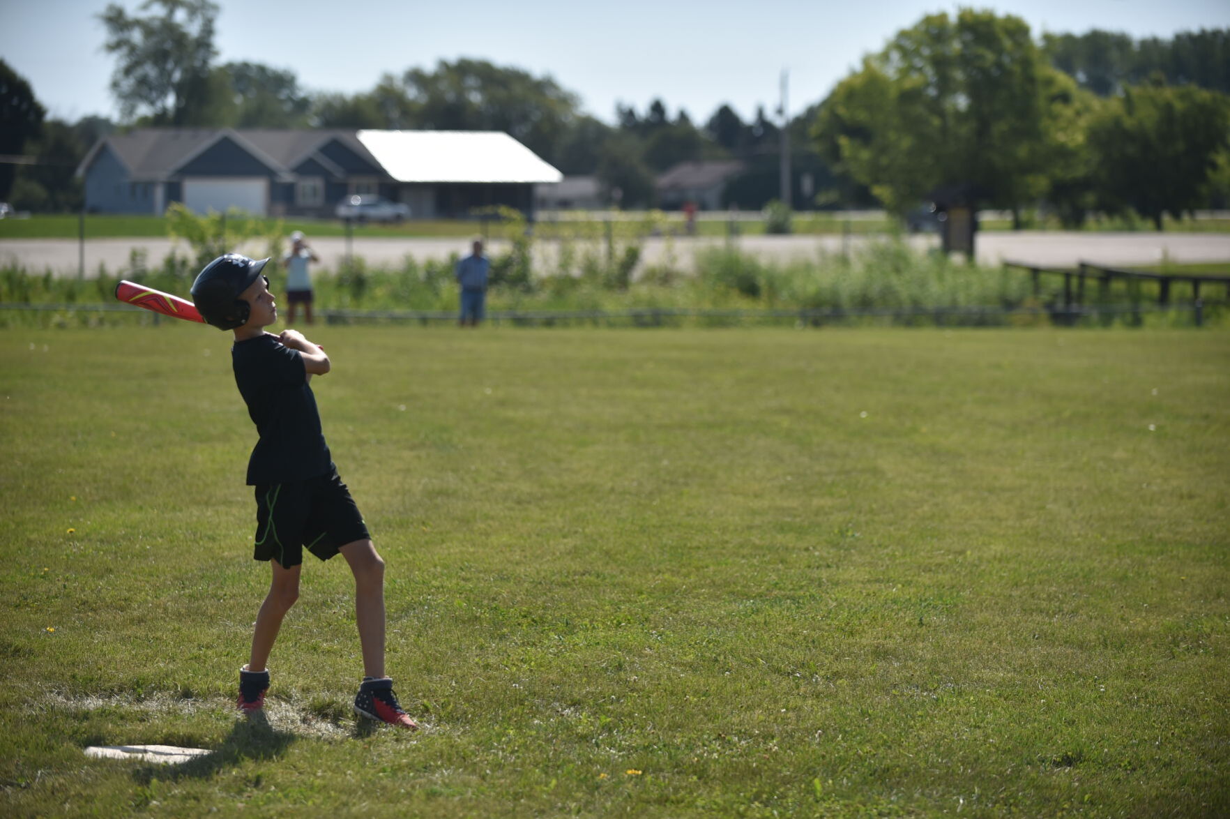Braden Harlan watches one fly